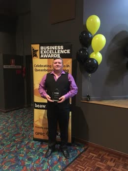 Danny of Resort Trailers holding the Business Excellence Award