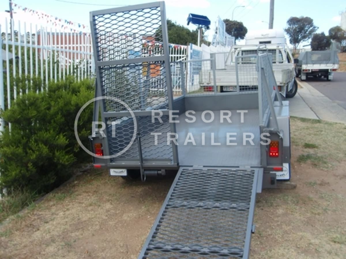 Small vehicle trailer with one side down — built by Resort Trailers